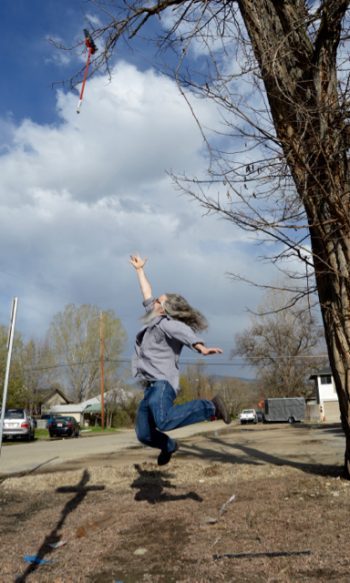 Broom in tree and man jumps
